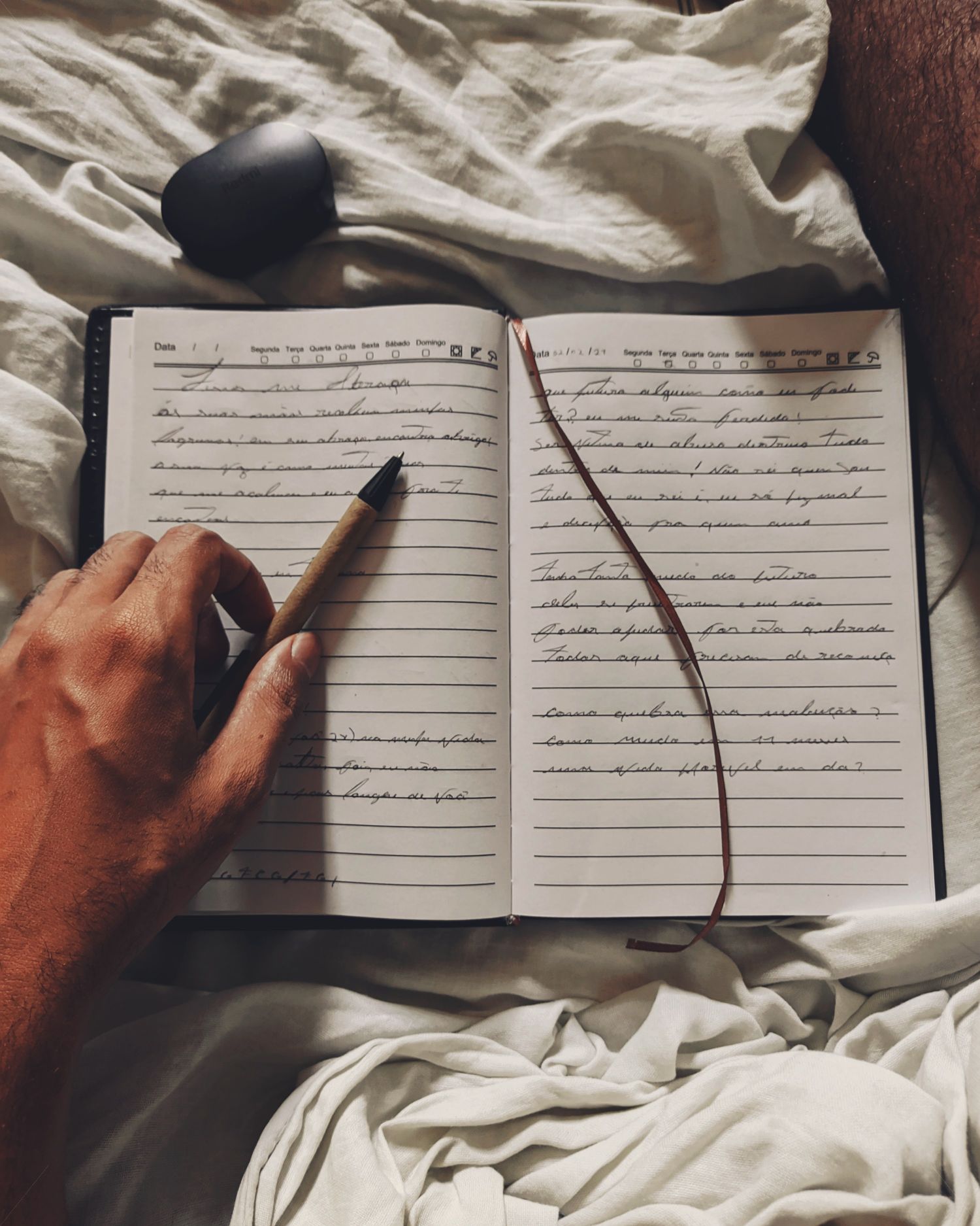 A person writing in a notebook
